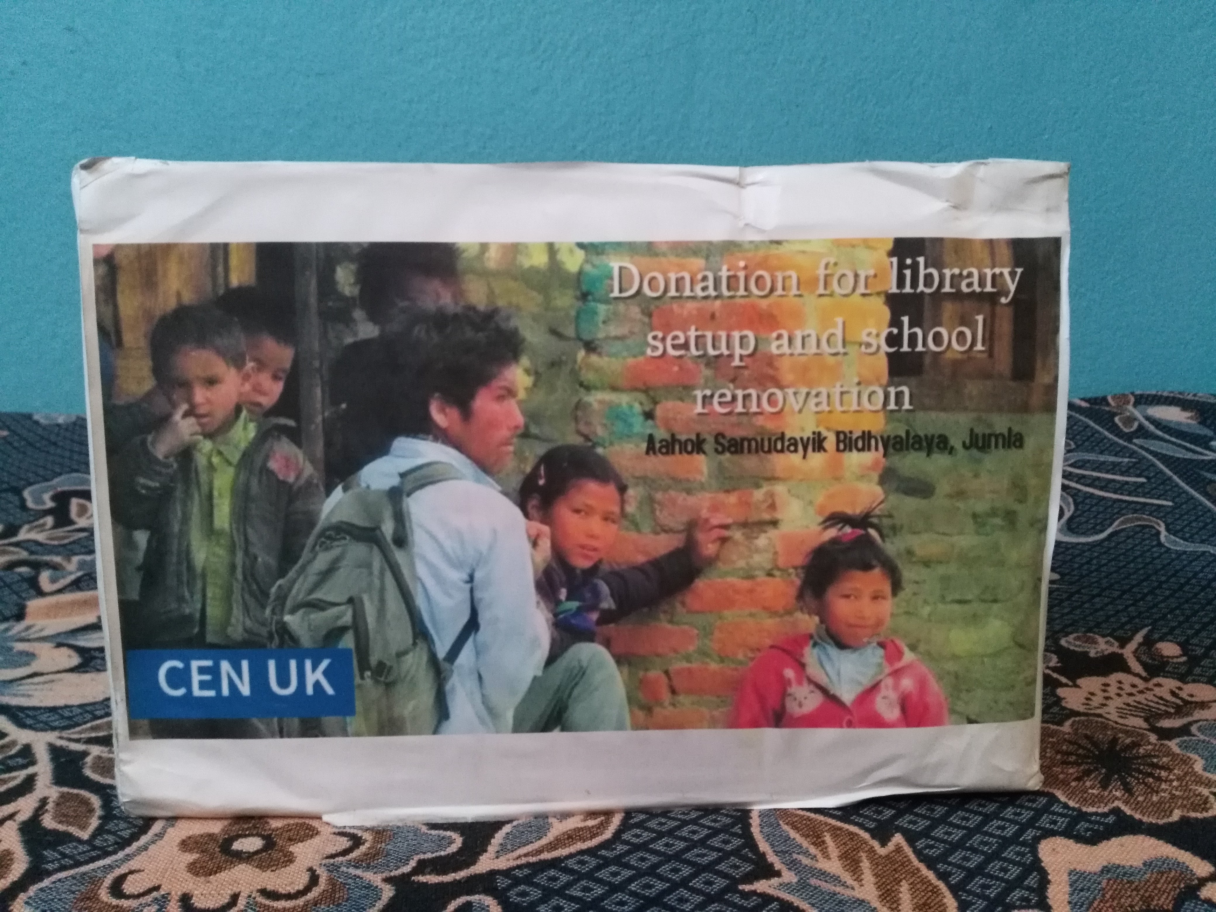 Donation box explaining the school library and renovation fundraising project in Jumla