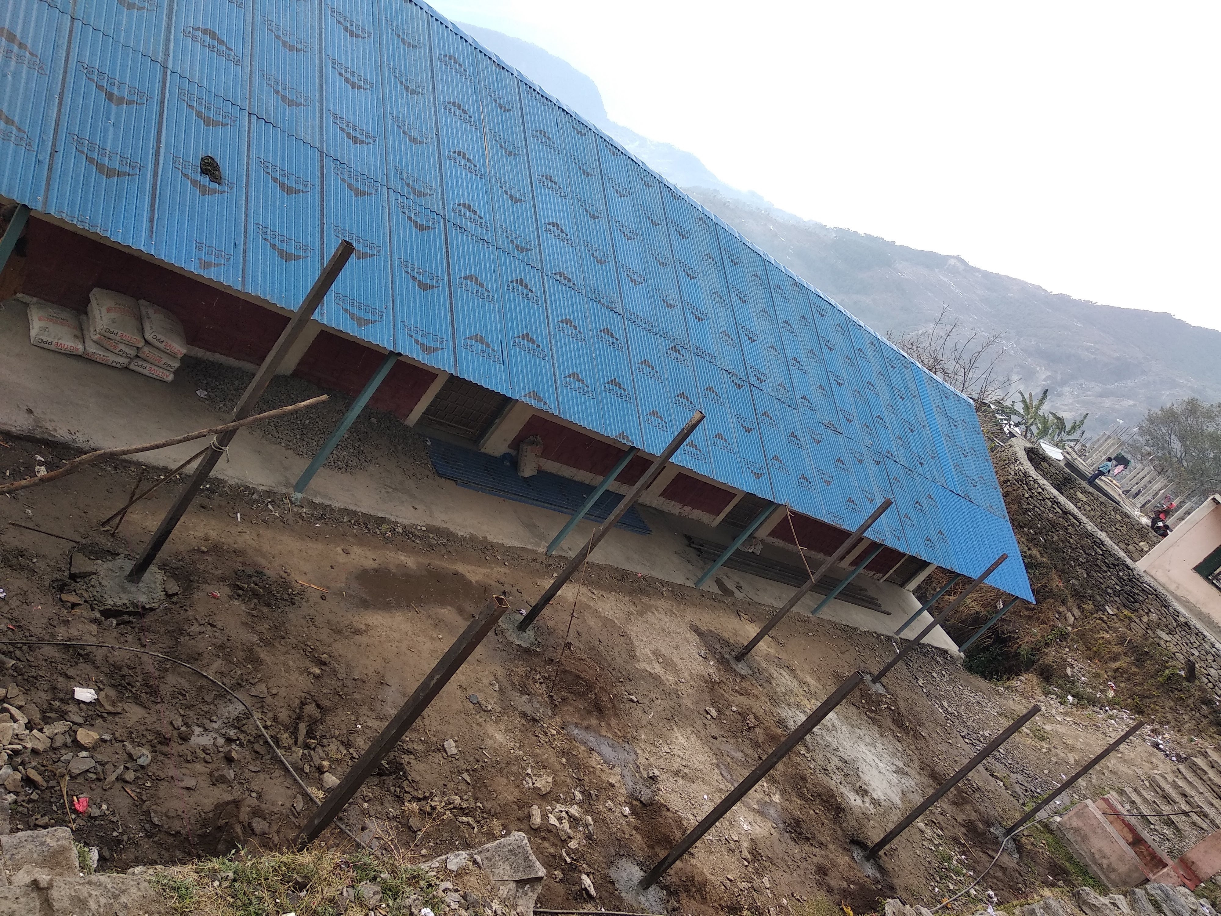 Initial steel structure fixed to the ground for the covered learning area in Rasuwa