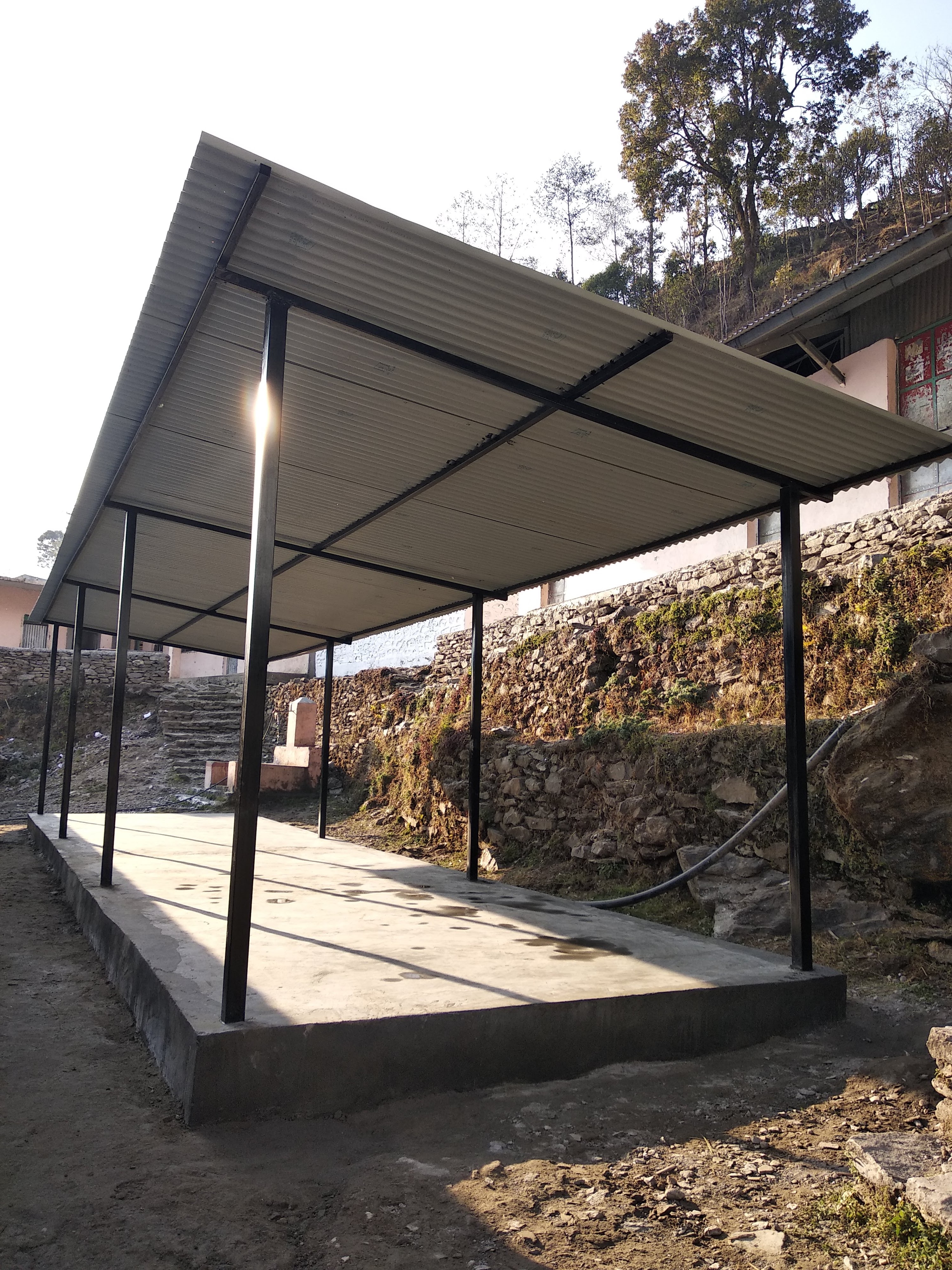 Roofing being installed over the learning area in Rasuwa